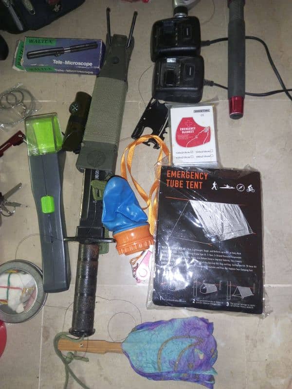 Camping bag filled with survival gadgets. 7