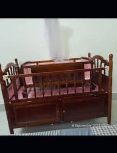 wooden baby bed and cradle