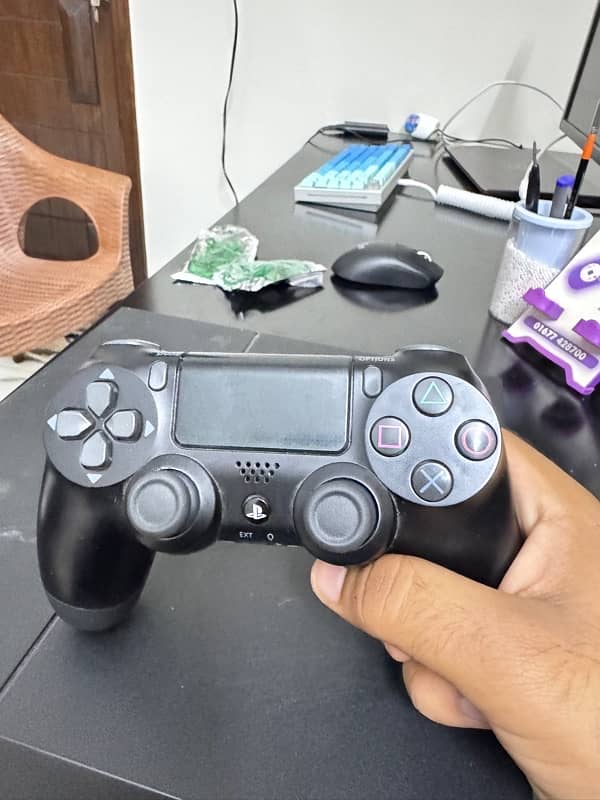 playstation 4 with two controllers 1