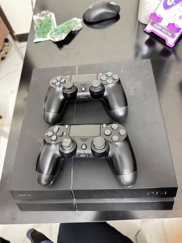 playstation 4 with two controllers 3