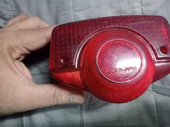 it's Honda 70 and 125 old model back light cover made in Japan