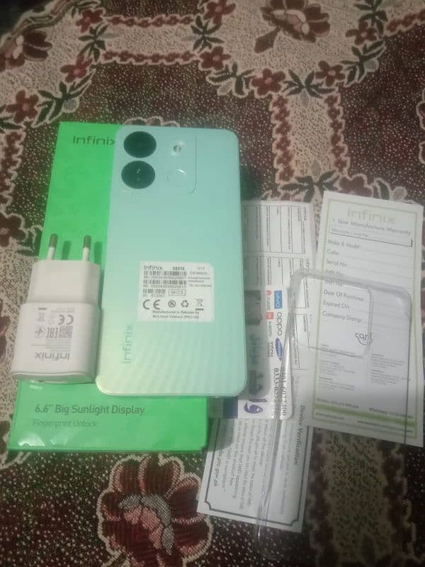 Infinix smart 7 4/64 with boxcharger 0