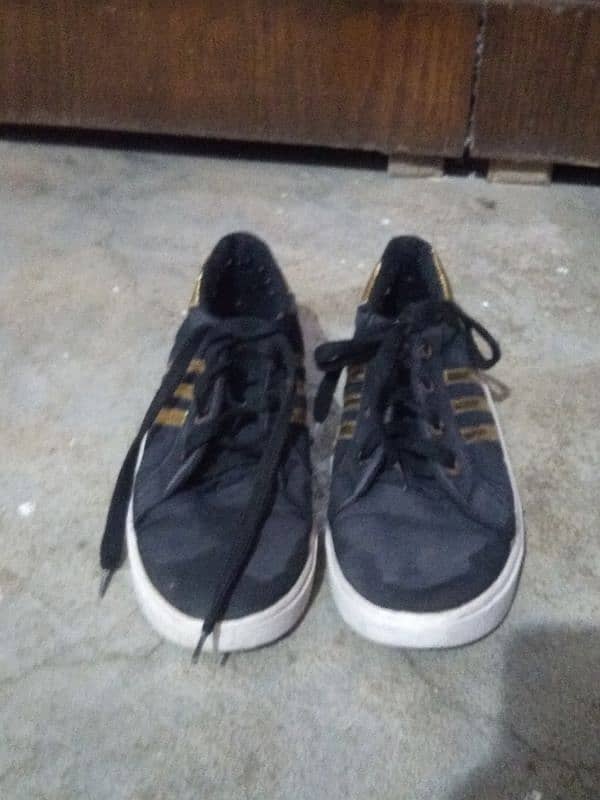 black sneaker with Golden design 0