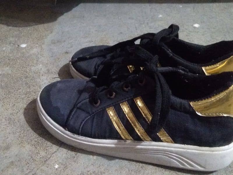 black sneaker with Golden design 1