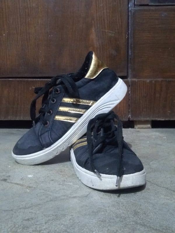 black sneaker with Golden design 2