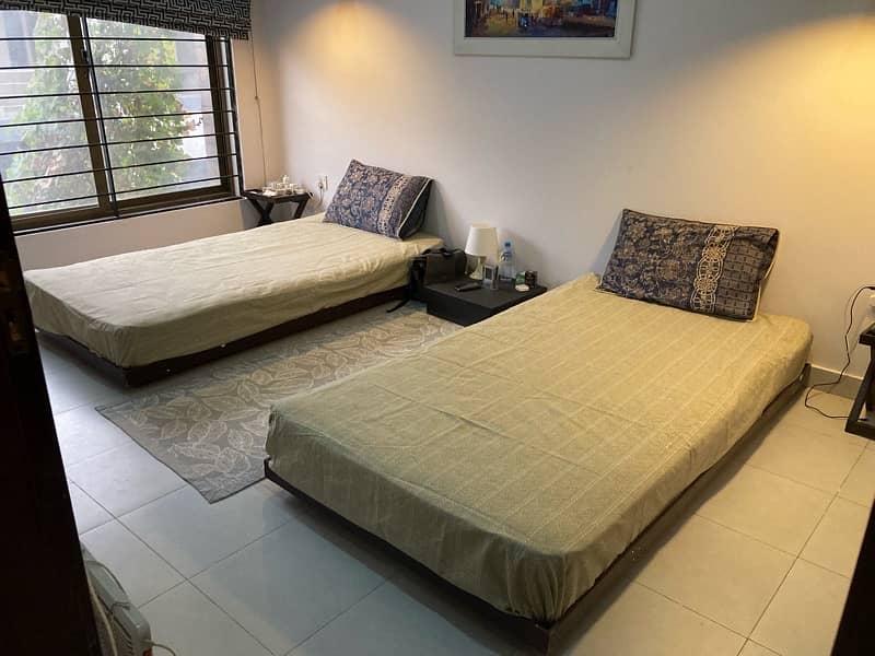 2 single beds with mattress + 1 Center Table 0