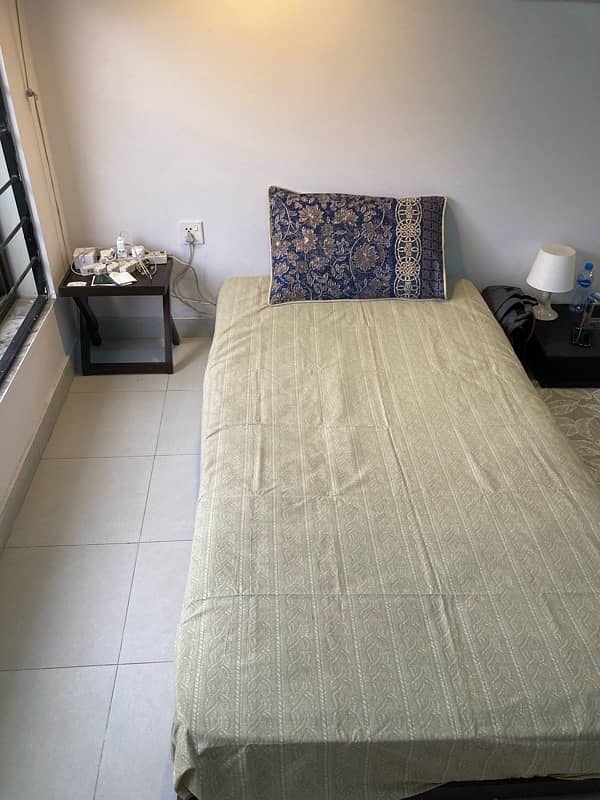 2 single beds with mattress + 1 Center Table 2