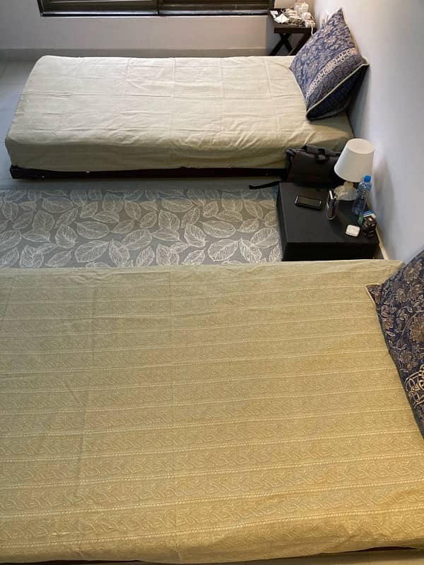 2 single beds with mattress + 1 Center Table 3