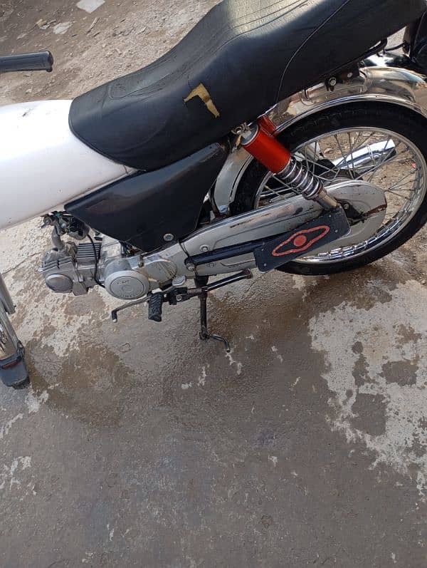 United 70cc for sale with original tank and side covers. 4