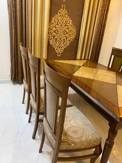 wood dinig table with 6 wooden chairs