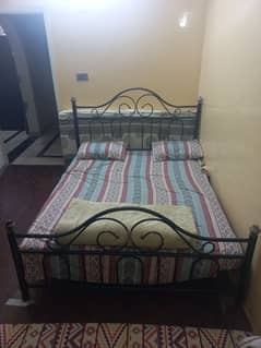 Iron bed without mattress.