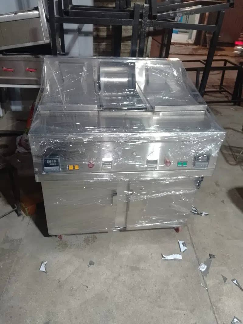 All kitchen Equipemnts , Fryer, hot plate , Working table, 1