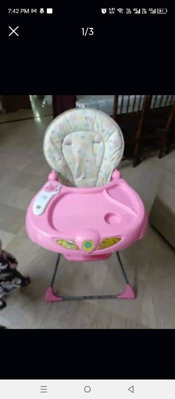 Baby high chair. good condition. music on 0