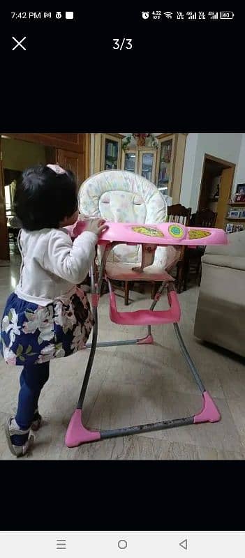 Baby high chair. good condition. music on 2