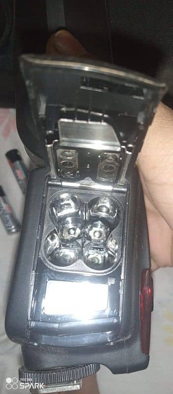 camera. stick. flash. charger. two batteries 13