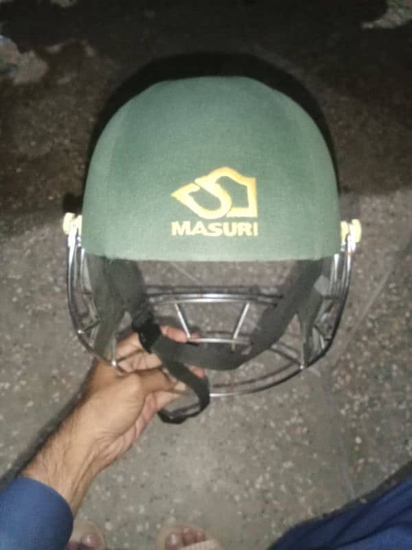 Cricket pads and helmet 2