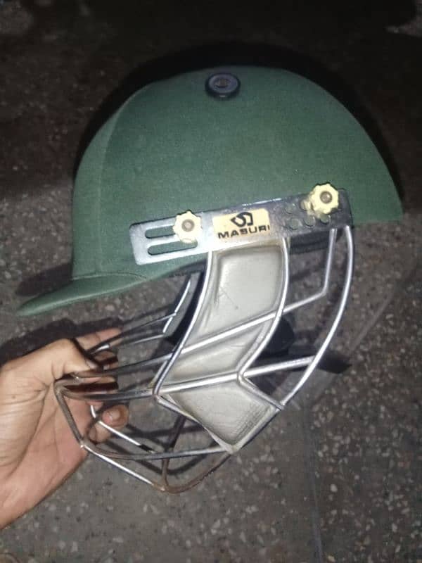 Cricket pads and helmet 3