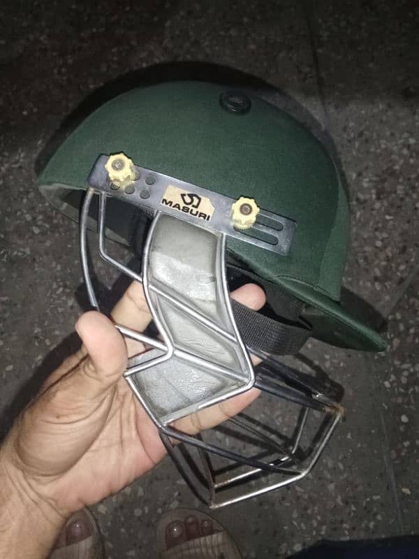 Cricket pads and helmet 5