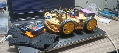 Gesture controlled plus obstacle avoiding robotic car for students