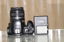 1000d canon with 18-55mm lens and all accessories