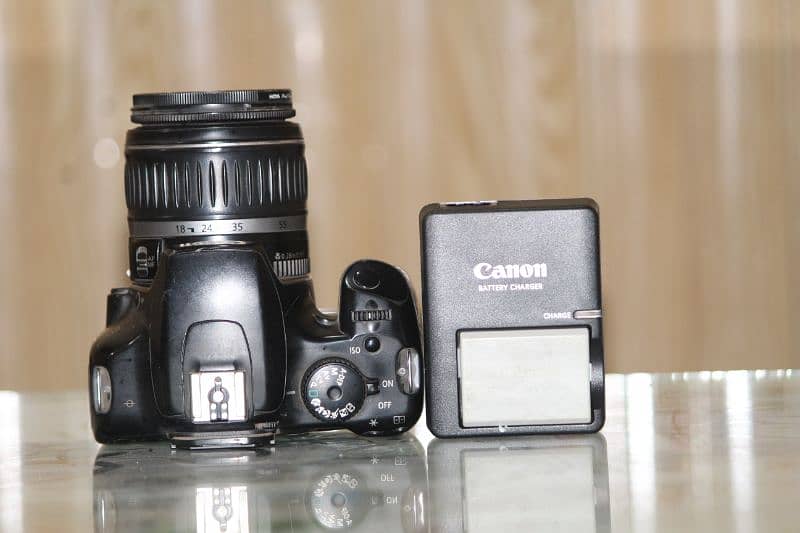 1000d canon with 18-55mm lens and all accessories 0