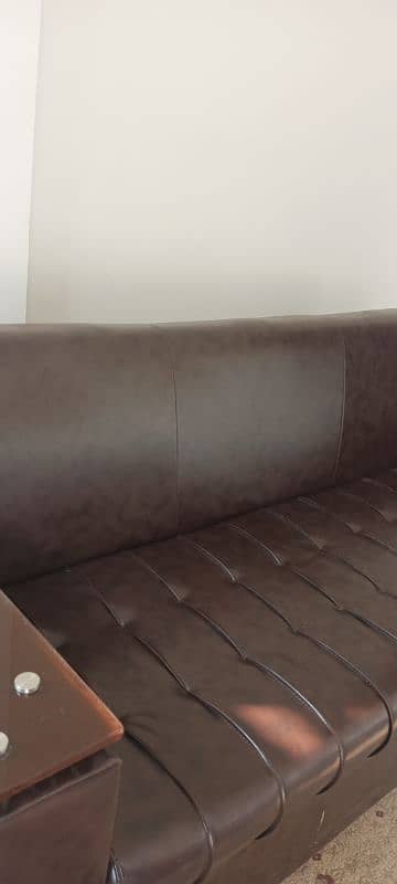 5 seater Sofa set with center table. leather look 10/10 condition. 2