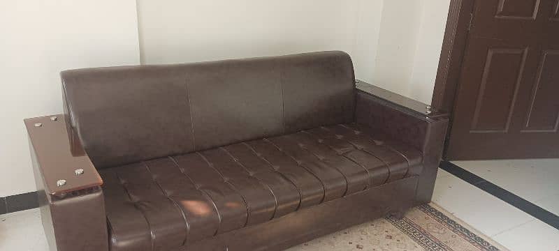 5 seater Sofa set with center table. leather look 10/10 condition. 3