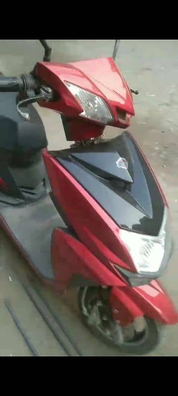 red electric scooter 0