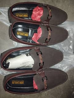 Two pair of shoes with socks