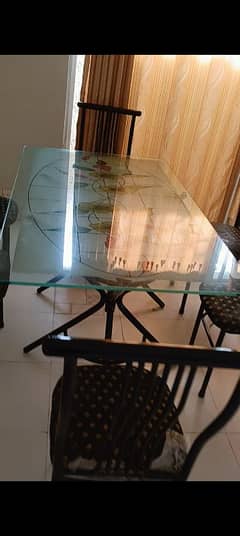 Dining table with 6 chairs. 8mm Glass top.