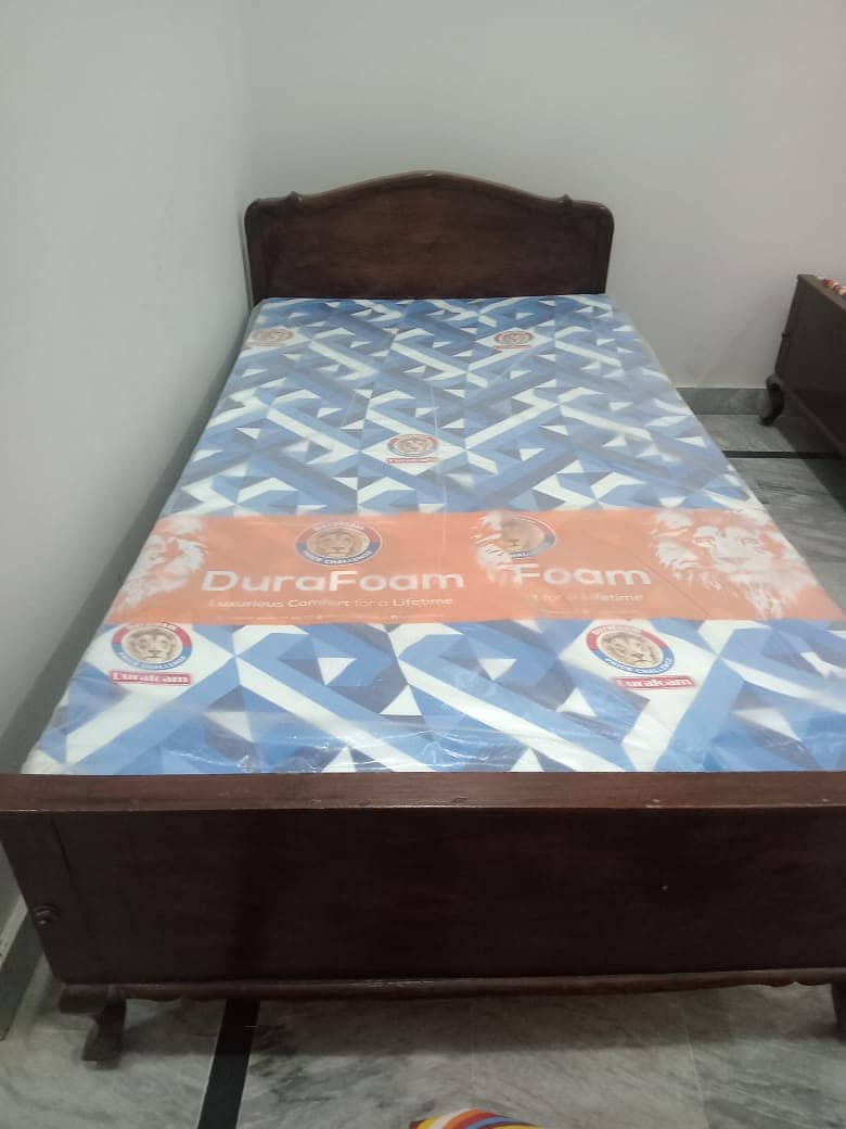 Two single beds with mattress 0