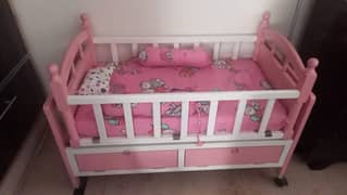 baby cot for sale . in pink colour