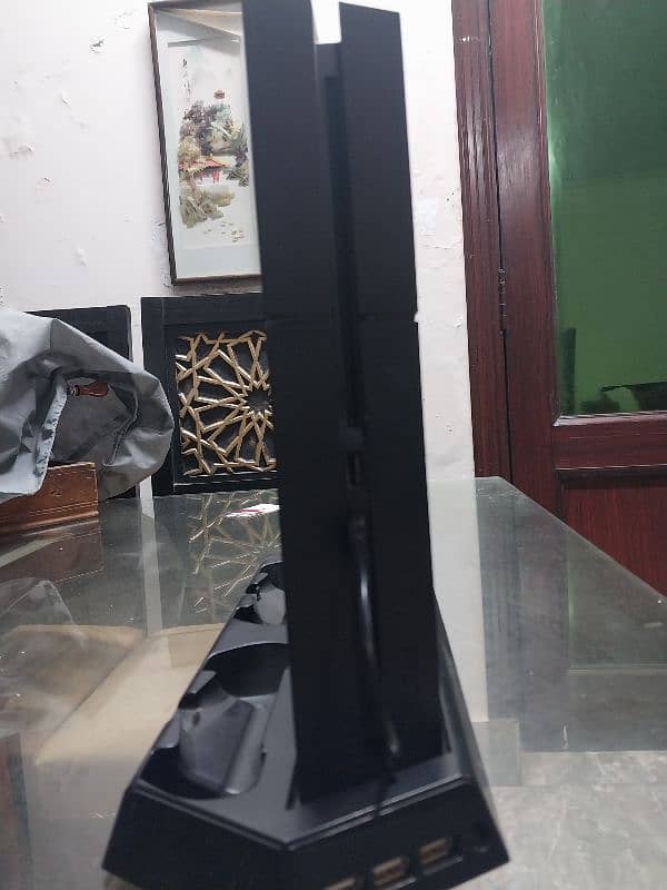 PS4 Base Model 500 GB Storage With A Controller And A Cooling Fan 3