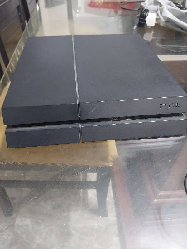 PS4 Base Model 500 GB Storage With A Controller And A Cooling Fan 4