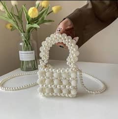 Fancy pearl cross body bags