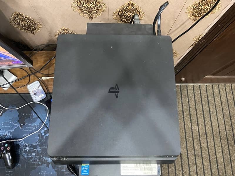 PlayStation 4 Slim 1TB with 2 Controllers and 2 Free Games 1