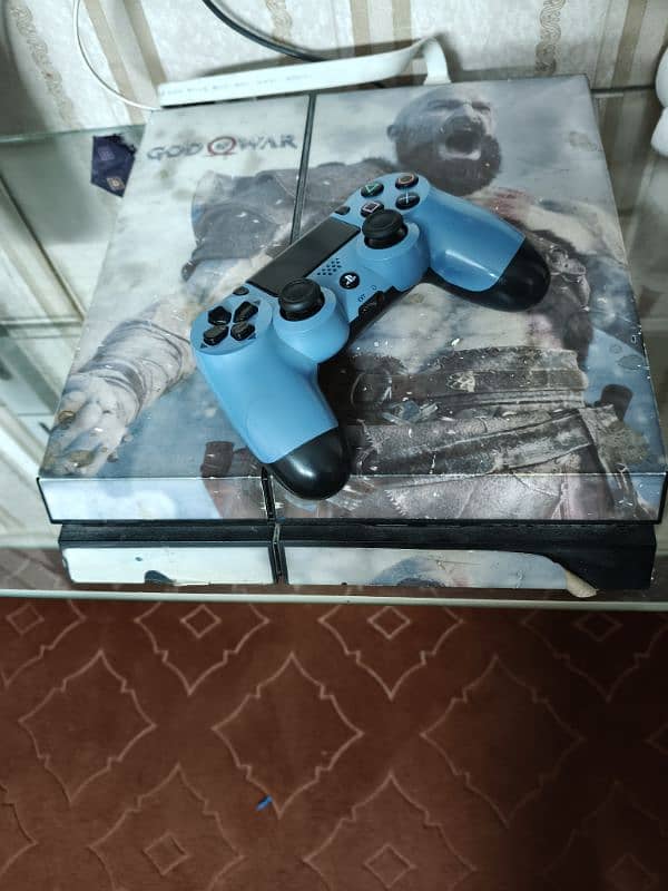 PS4 console with controller 0