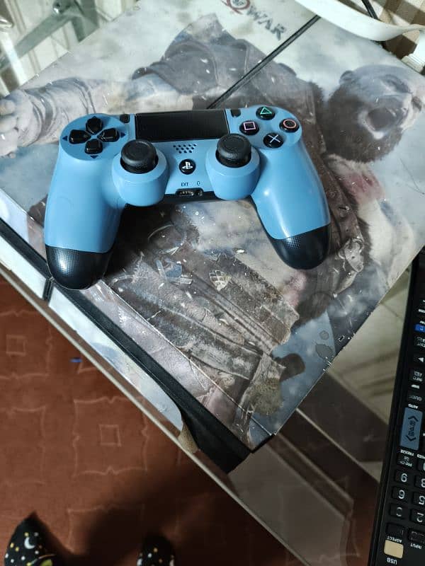 PS4 console with controller 1