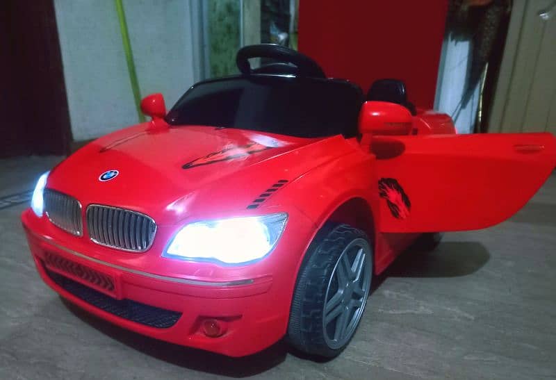 kids BMW imported car Good condition 100℅ok with remotecontrol & swing 2