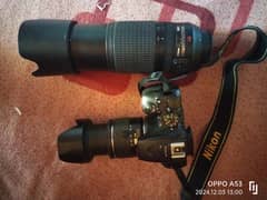 Nikon D5000 with 2 lens  33/55   & 70/300