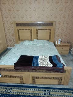 double bed with one side table