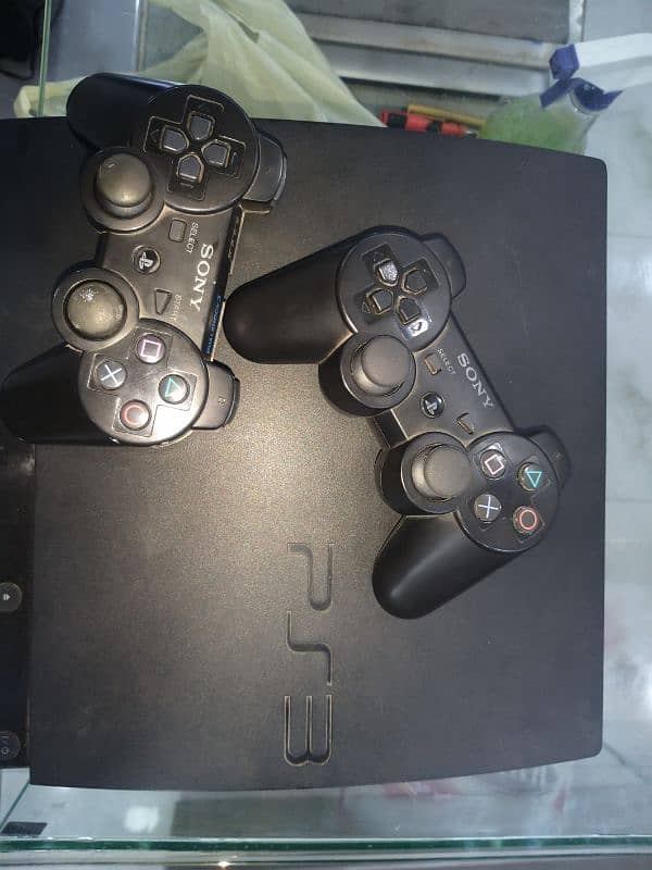 PS3 playstation with 2 remotes 3