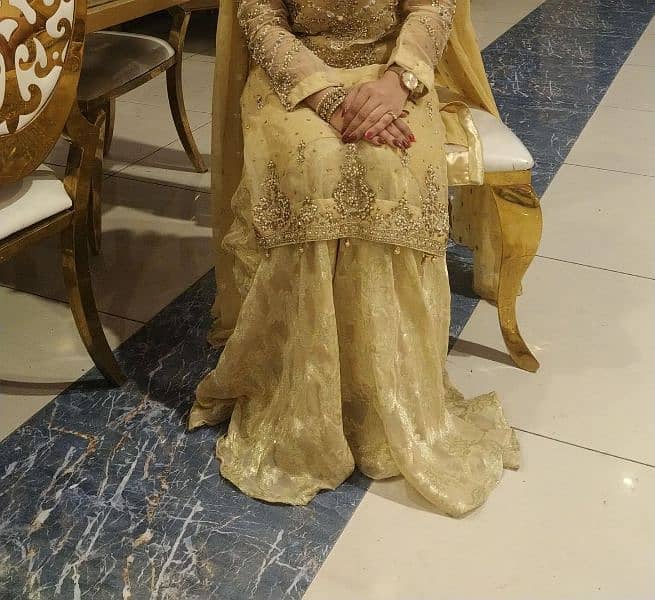 golden shirt , gharara with clutch 0