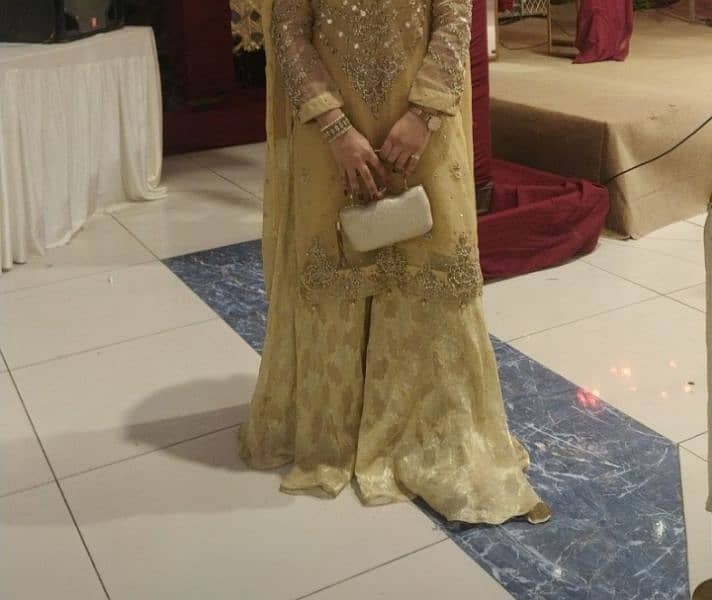 golden shirt , gharara with clutch 3