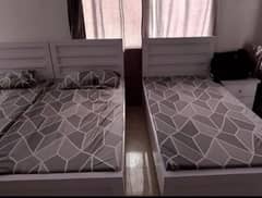 3 beds with two sides and one dresser