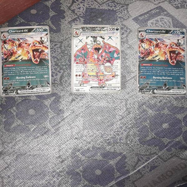 Selling 3 double rare charizard with hp of 330 in very good condition 0