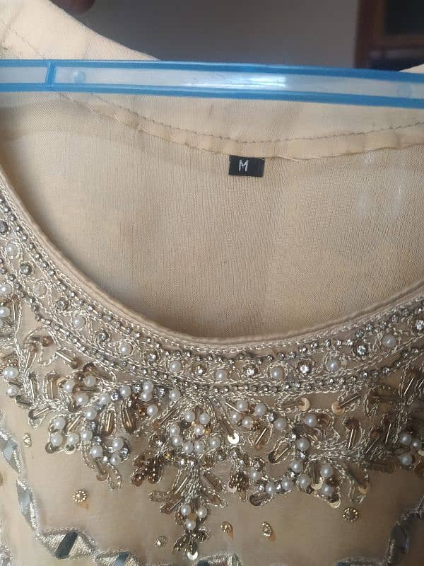 golden shirt , gharara with clutch 5