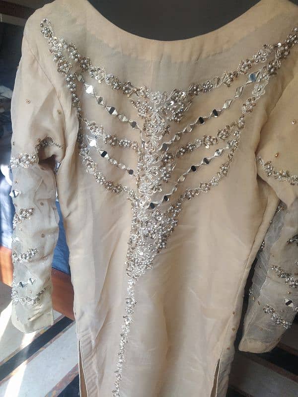 golden shirt , gharara with clutch 9