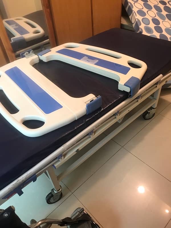 articulated hospital bed with mattress and inflatable air mattress . 5