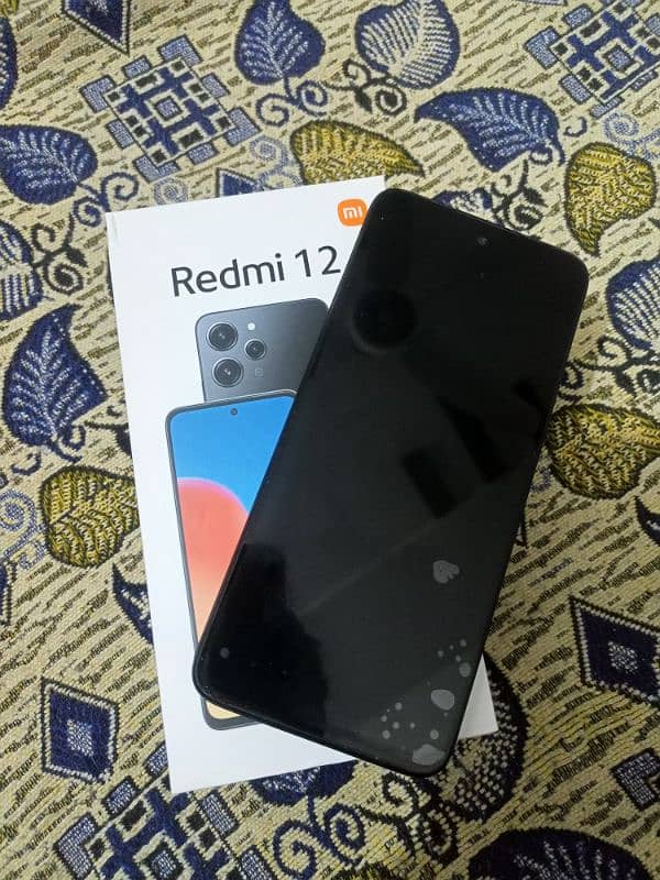 xiome Redmi 12 Brand New mobile 8_128 GB one Hand Use 2